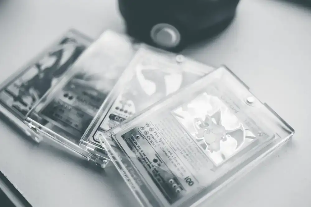 Stacks of rare trading cards being evaluated on a pristine desk